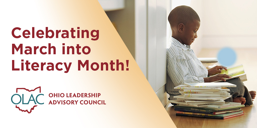 Young boy sitting cross-legged on the floor surrounded by a pile of books while reading one of them. Words across the image read 'Celebrating March Into Literacy Month'