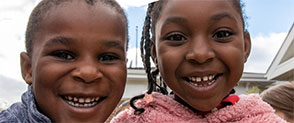 Two children smiling