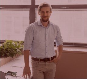 Man standing at a desk in an office